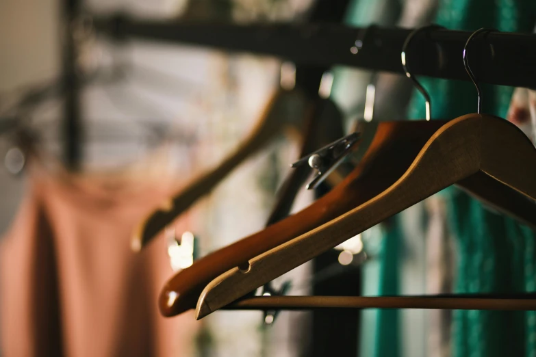 wooden hangers are hanging on the wall