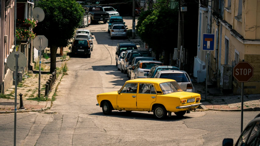 a car parked next to a street filled with vehicles