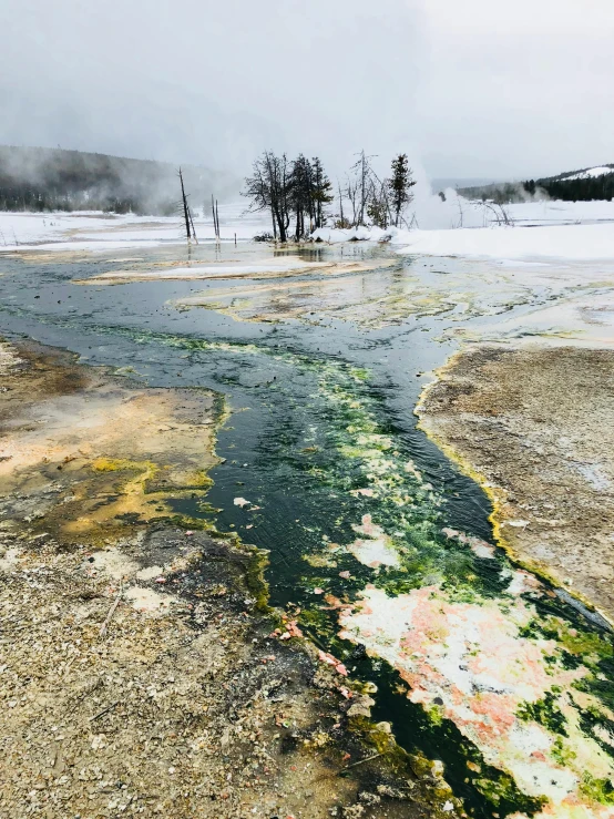 there is a very pretty lake surrounded by ice