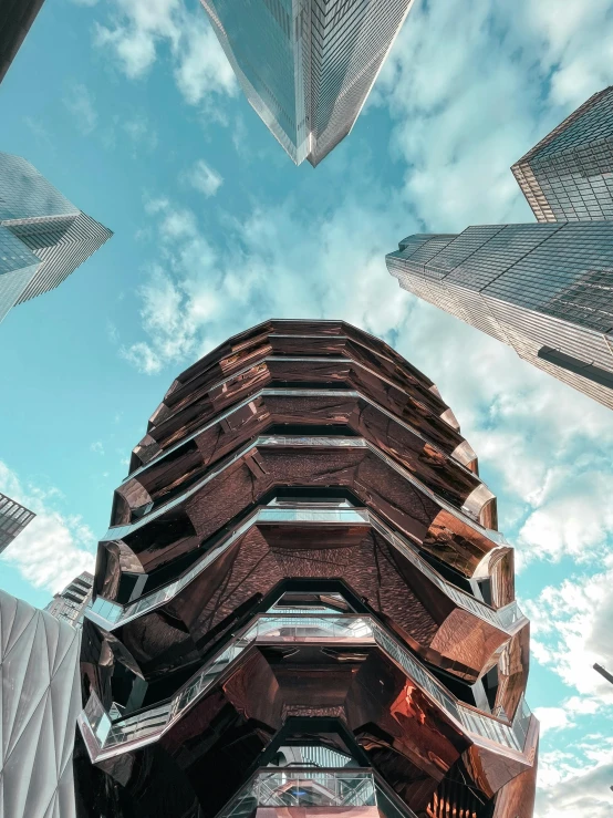 a very tall building sitting in front of some very tall buildings