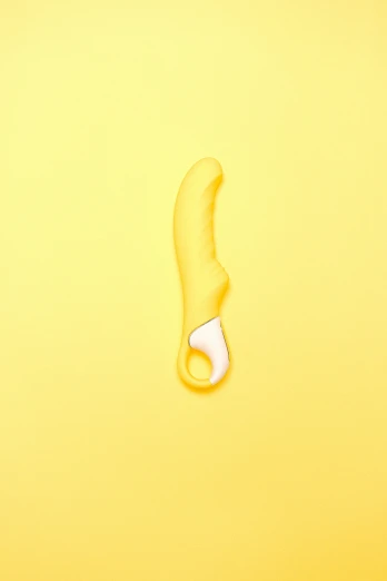 a computer mouse and a banana peel on a yellow background