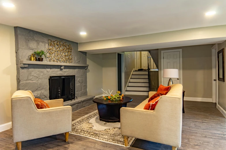 two armchairs and a table in a large room