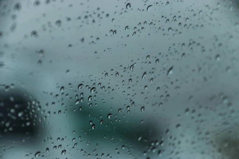 rain is coming down on the windshield