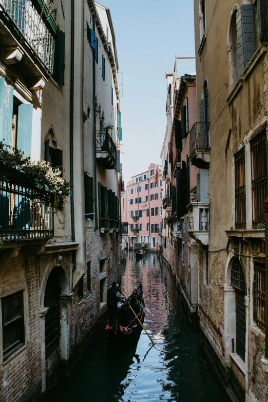 a narrow canal in an old european city