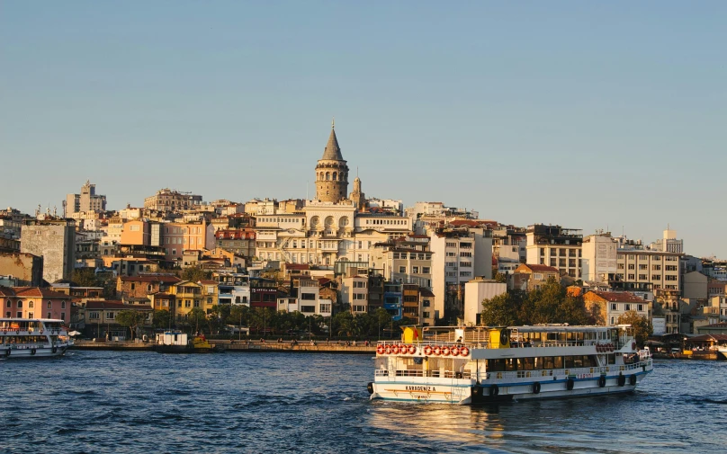 a very large boat floating on the water next to some buildings