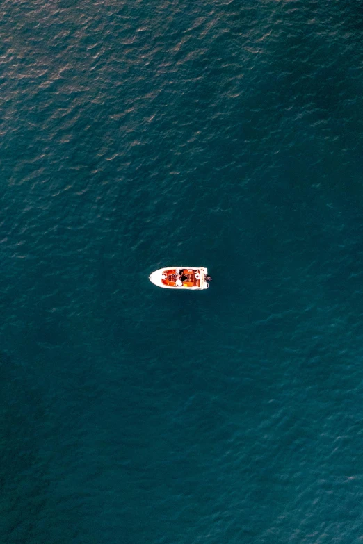 two boats floating in a body of water near each other