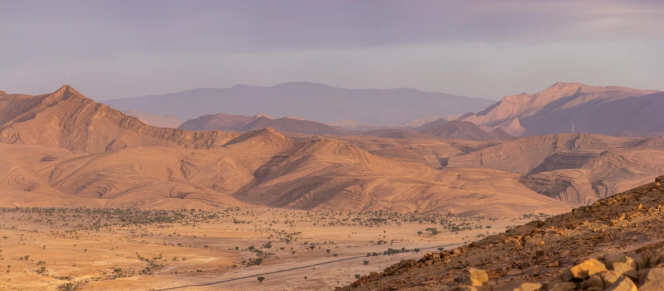 a mountain range is shown in the distance