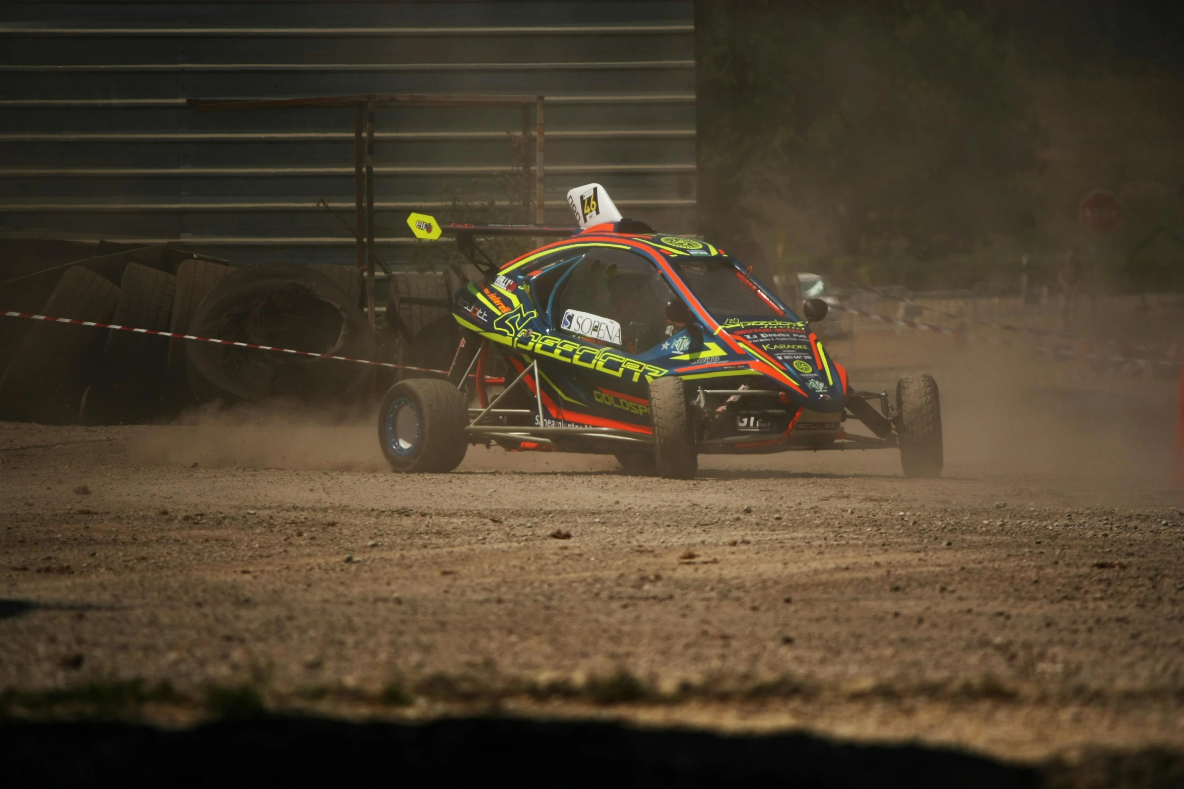 a man driving his car while holding on to a rope