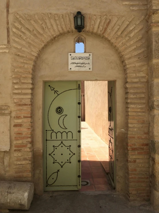 an arched entry to an area with the doors open