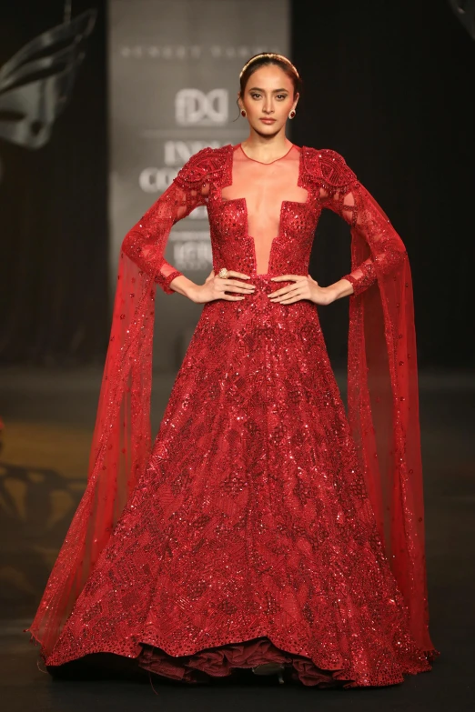 the gown is made with sparkling red sequins and sequin lace