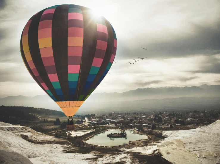 a  air balloon is seen in the sky with clouds