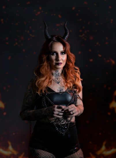 a woman wearing a horned outfit in a dark background