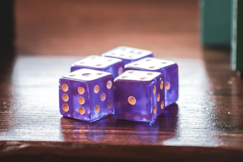 a close up of a number of purple dices