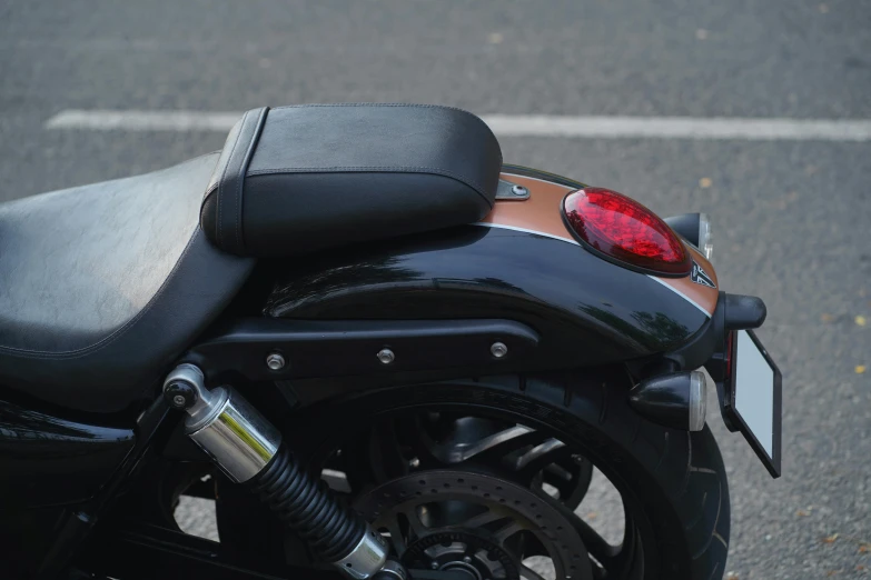 a close - up of the side view of a parked motorcycle