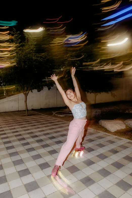 girl jumping on checkered floor while dancing on one foot