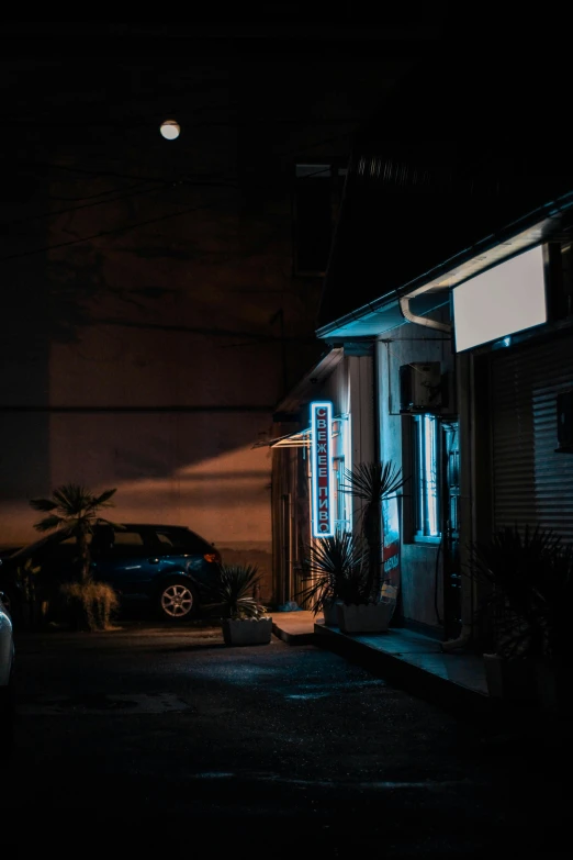 a car parked in front of a building on the side of the road