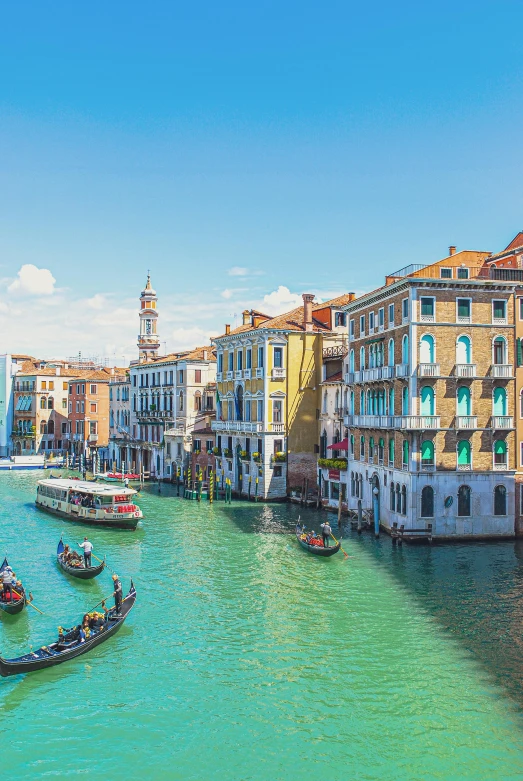 the town has a wide canal with small boats in it