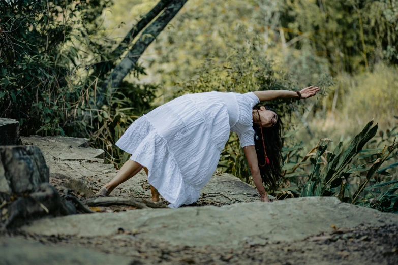 the woman has her arms stretched out to take a break