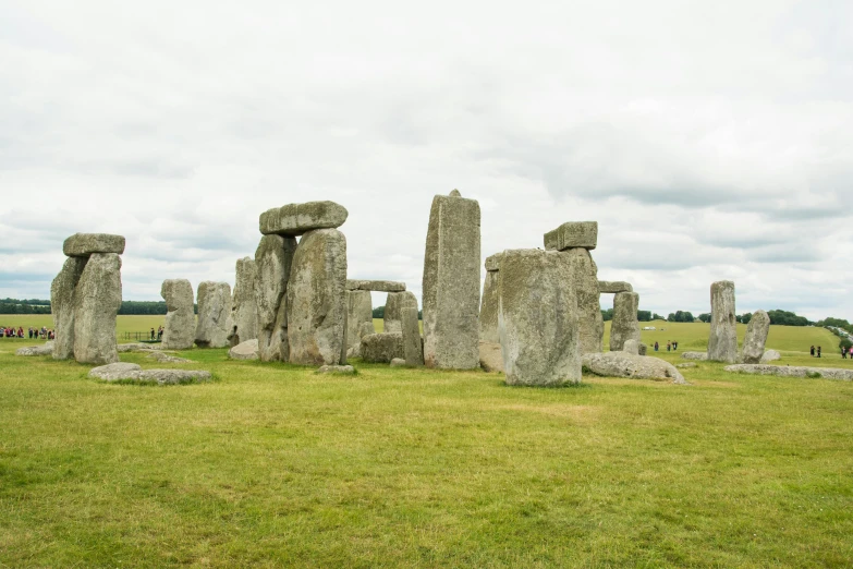 stonehenges sit in the grass and stand tall