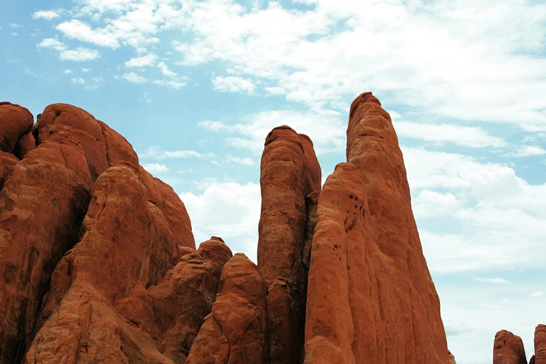 three tall rocks that are next to each other