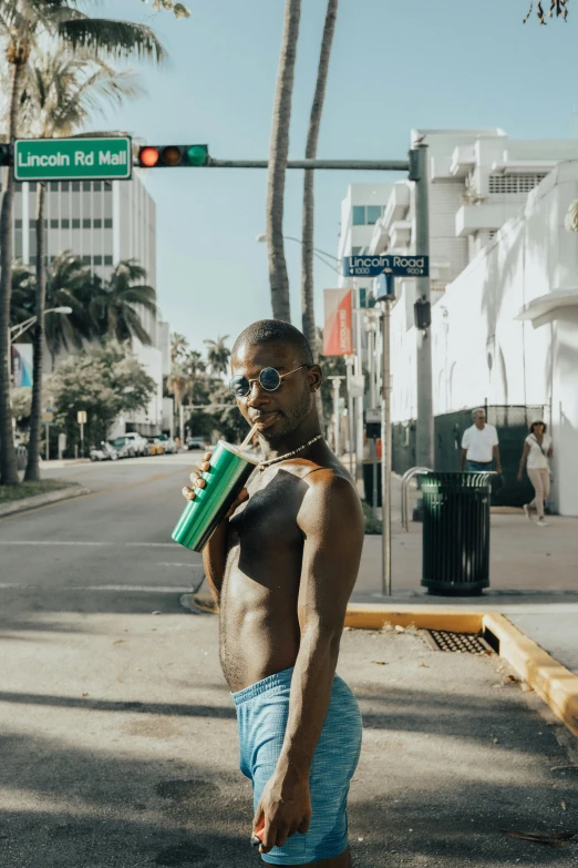 a  person on the street drinking a drink