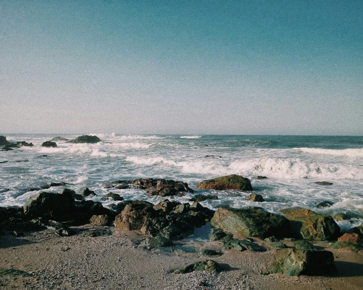 the rocks and water at a rocky beach