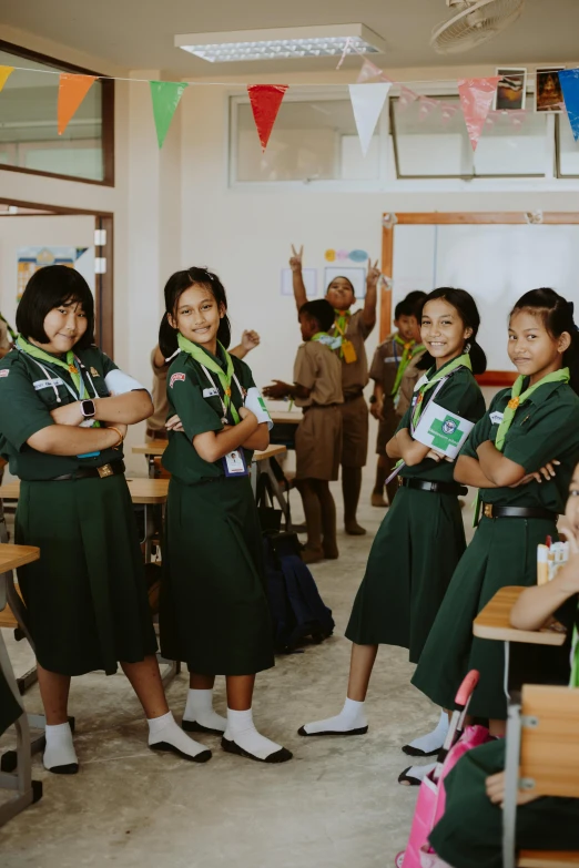 two school girls and a male students at the front