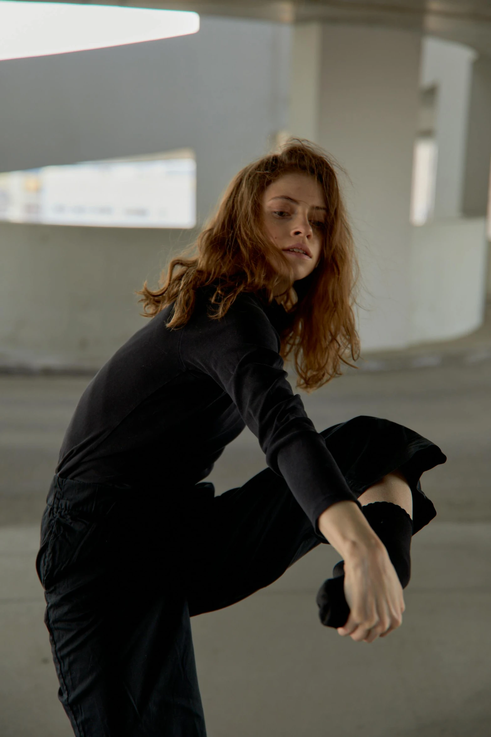 a woman standing with her arms spread out