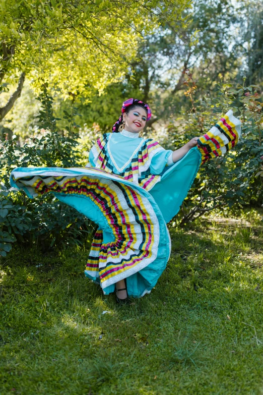 an indian woman dressed in traditional clothing holding a fabric