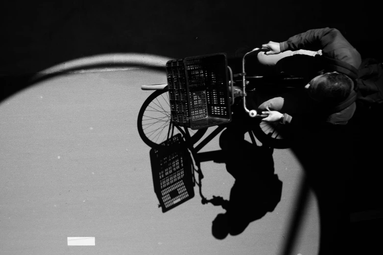 black and white pograph of man on bicycle