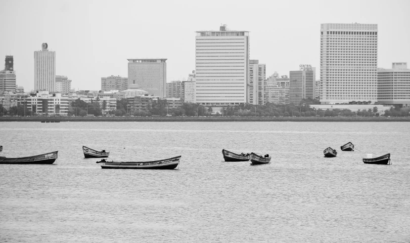 several small boats sitting in the water