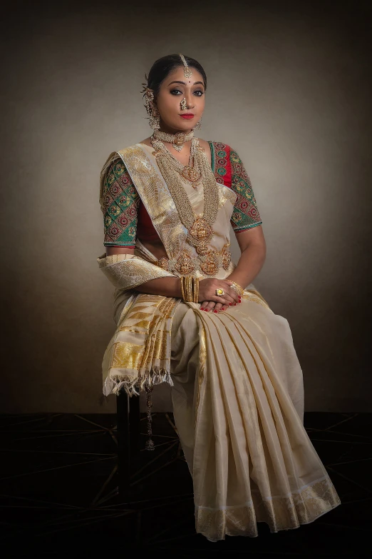 a woman sitting on a chair with her face painted as if an indian