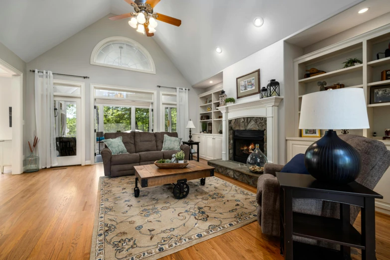 a living room has a large coffee table and some chairs