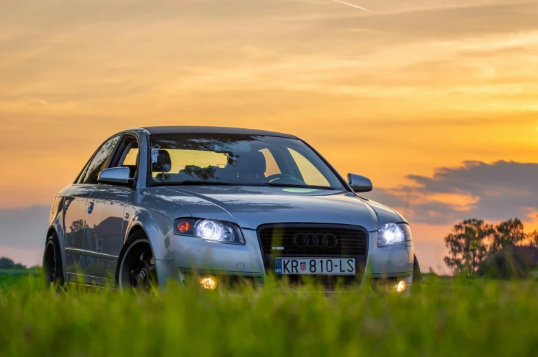 a car that is parked in the grass