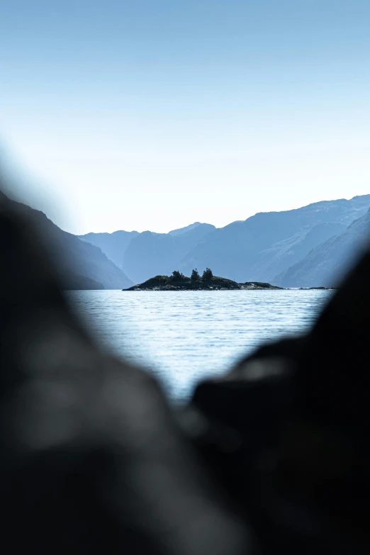 some hills with water and a small island