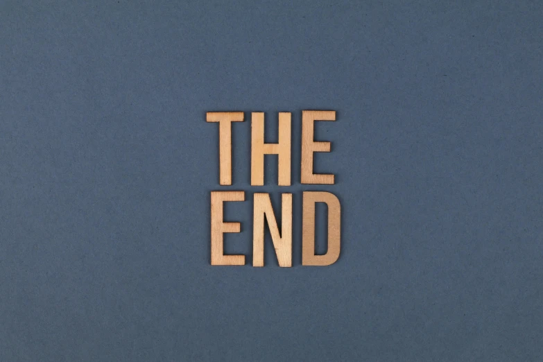 the word the end is written in cut out wood