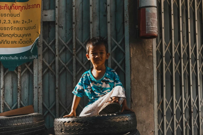 a  sitting on some old tires