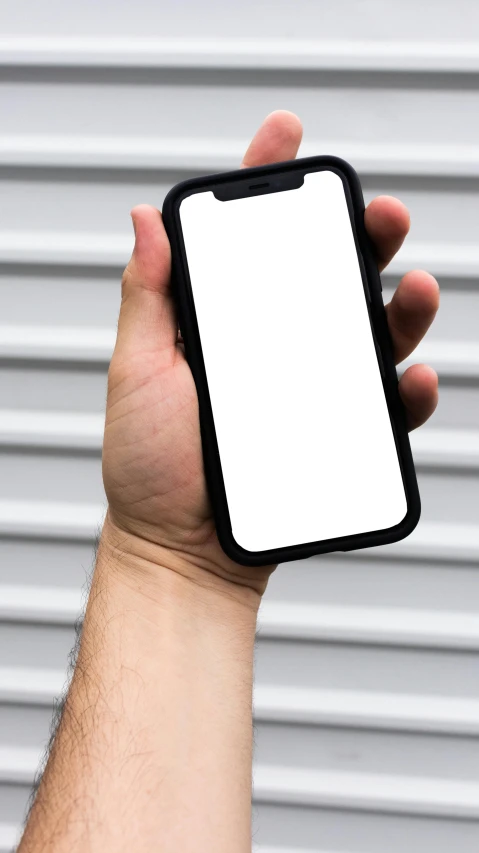 a hand holds up an open cellphone mockup