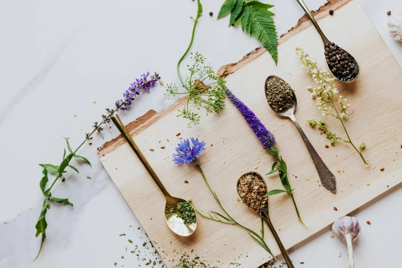 a picture of different spices on a  board