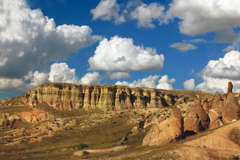 a large rock formation sitting on top of a hill