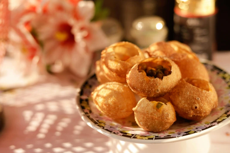 a plate of mini pastry is pictured on a table