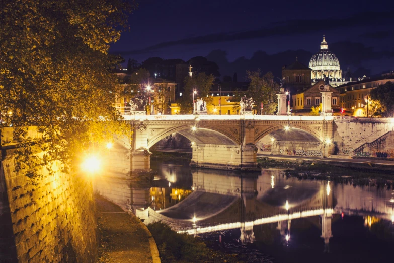 a view of the river with a city light at night