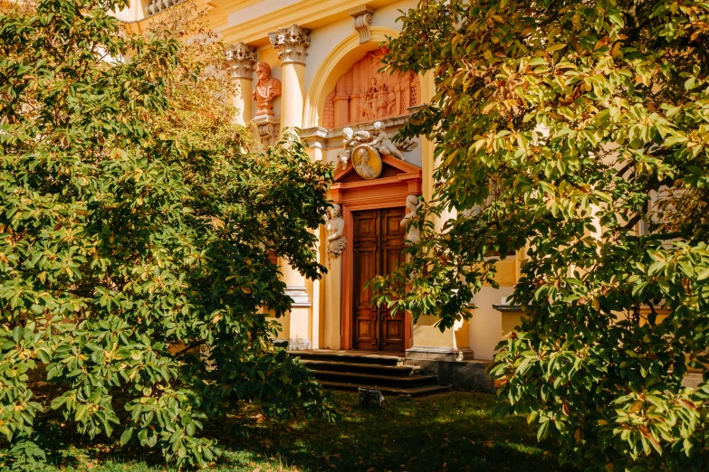 the front of a house with a clock in the window