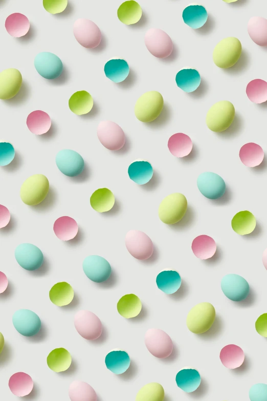 an array of pastel colored eggs scattered next to each other