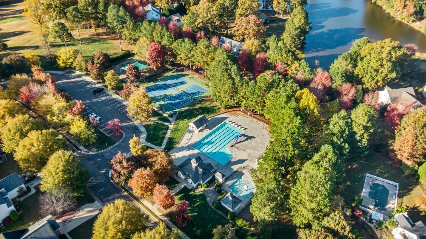 an aerial s of a pool and several houses