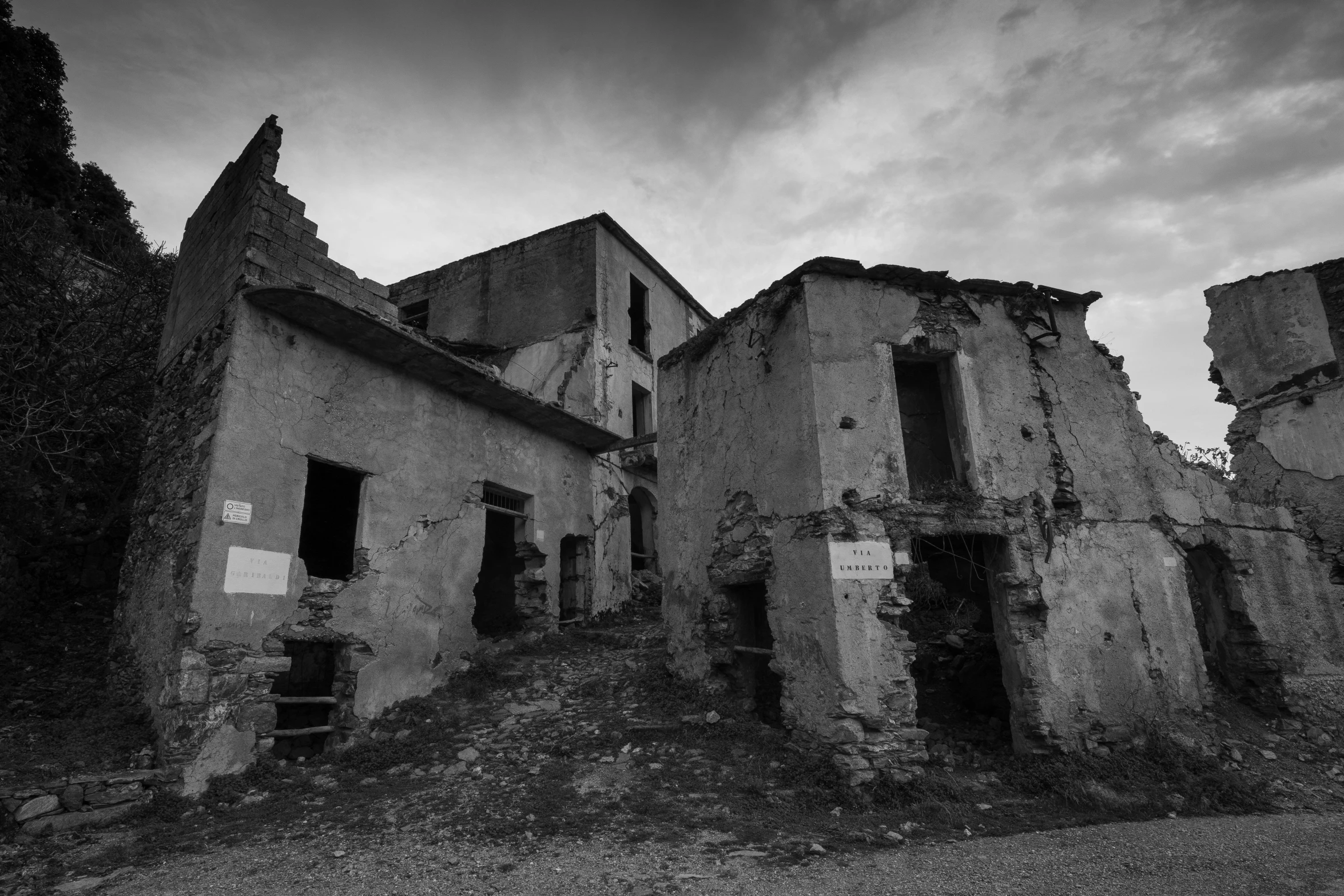 black and white pograph of ruined building in dusk