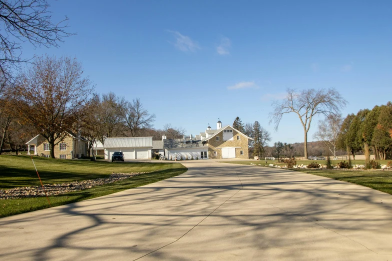 a large driveway in front of a white house