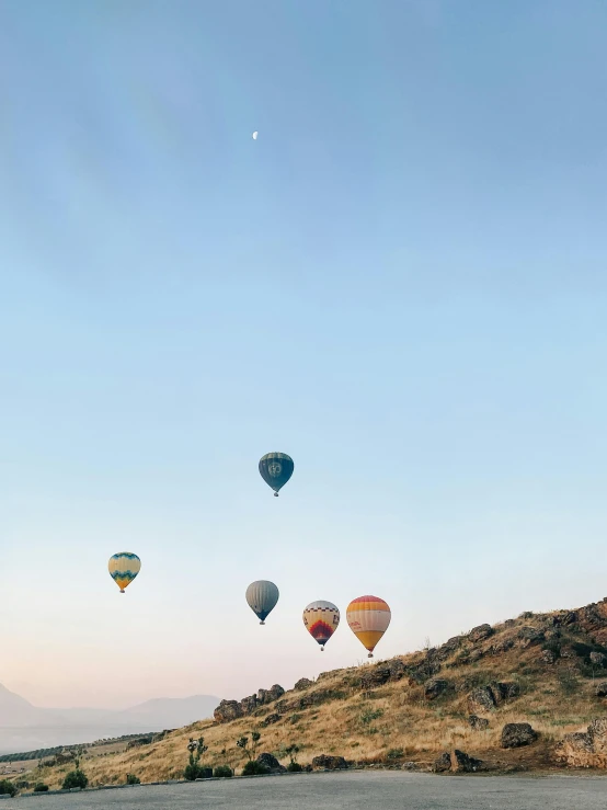 a group of  air balloons fly through the air