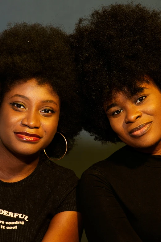 two young women pose for the camera