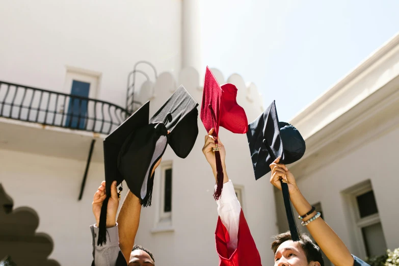 graduation students in front of a large building